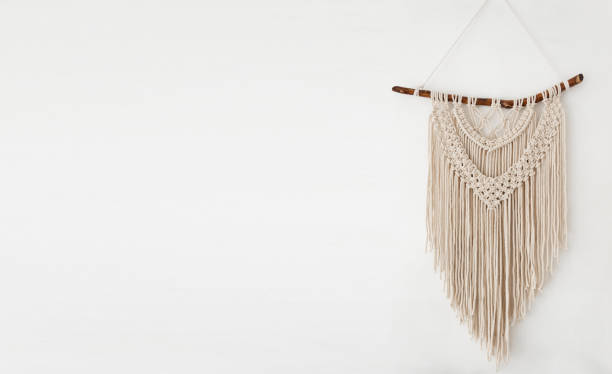 istock Handmade 100 cotton macrame wall decor hanging on a white wall. 1308776346