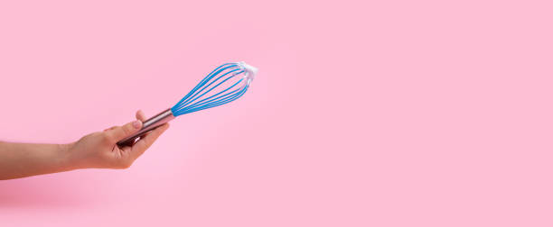 istock blue manual whisk in hand 1308778705