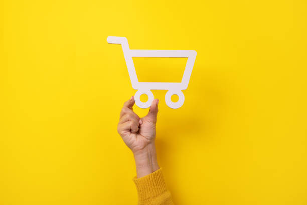 istock shopping cart in hand 1308778798
