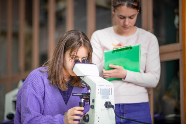 istock High school student participating in class at high school lab 1308782693