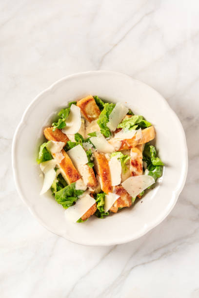 istock Caesar salad with grilled chicken, romaine and Parmesan cheese 1308782915