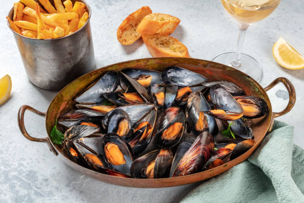 istock Mussels dinner with wine, fries, and toasted bread 1308783225