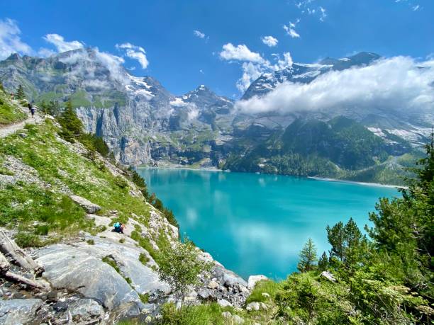 Lake Oeschinen Lake Oeschinen in the summer lake oeschinensee stock pictures, royalty-free photos & images