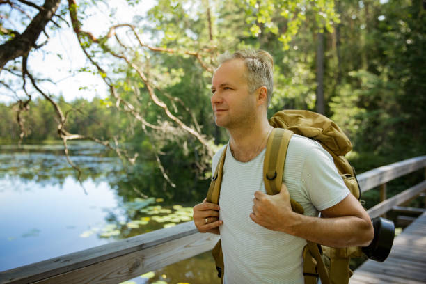 istock Mature man exploring Finnish nature in summer 1308787713