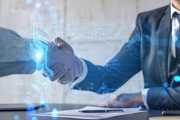 istock Double exposure of two businesspeople handshake and binary technology hologram drawing background. Concept of partnership and agreement. Formal wear. 1308789930