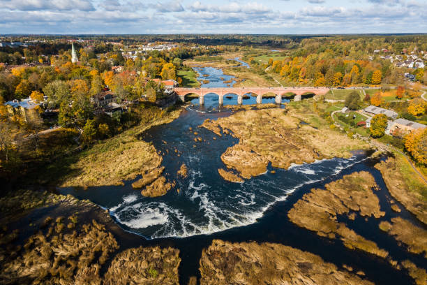istock Venta Rapid waterfall, the widest waterfall in Europe and long brick bridge, Kuldiga, Latvia. Captured from above 1308790555
