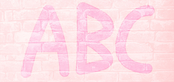 A light pink  coloured brick wall with rectangular blocks, textured grungy backgrounds having faded blue capital English letters ABC painted in gloss or shining finish. Apt for use as toddlers or babies related wallpaper, back to school designs, gift wrapping sheets or backdrop.