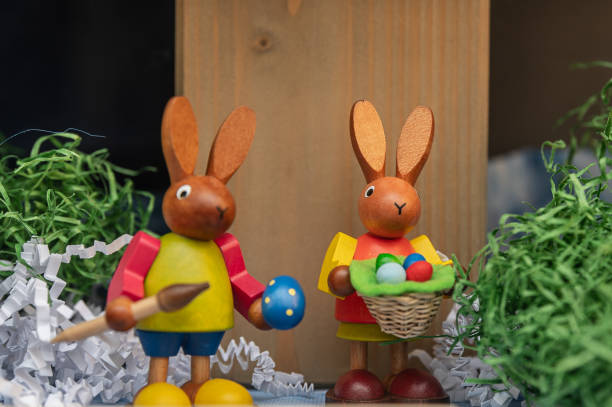 istock easter decoration with two Easter bunnies made of wood 1308793362
