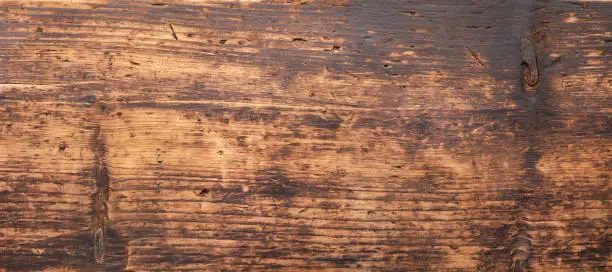 Photo of dark wood table background, brown board texture