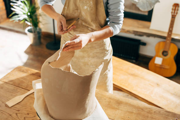 istock Serious clay artist preparing for handicraft lesson in studio 1308797933