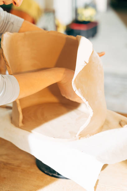 istock Unrecognized girl learning handicraft in pottery 1308797937