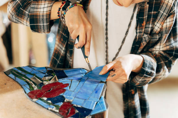 istock Skilful designer making panno or mosaics while working with the glass 1308798140