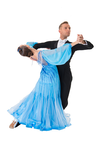 ballroom dance couple in a dance pose isolated on white background. ballroom sensual proffessional dancers dancing walz, tango, slowfox and quickstep. just dance