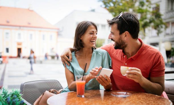 istock Happy couple drinking coffee in outdoors cafe on summer vacation 1308802188