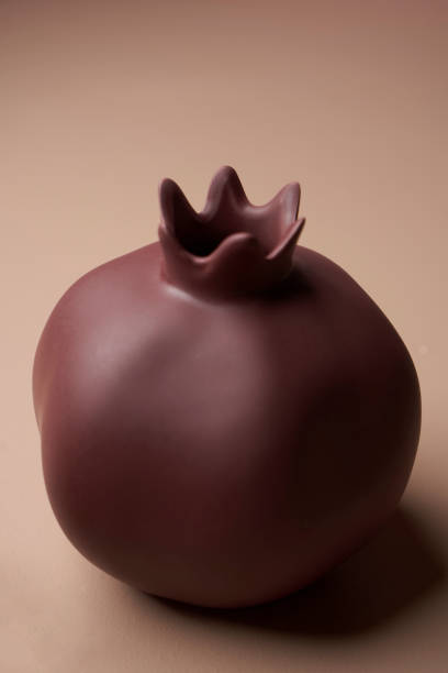 istock Colorful pomegranate on pastel color background 1308808386