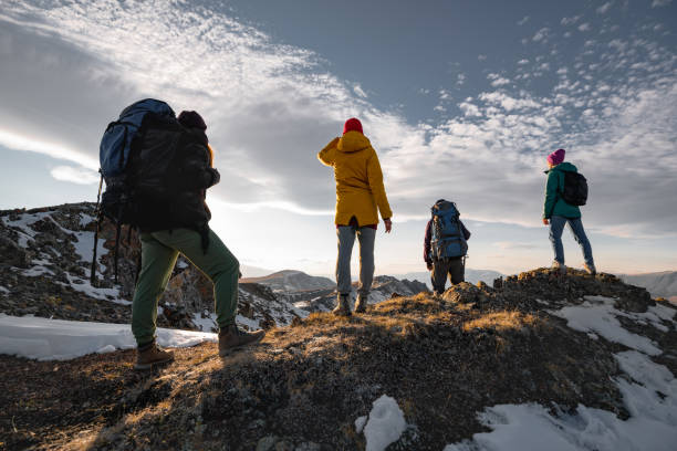 istock Hikers or tourists are relaxing on mountain top 1308809104