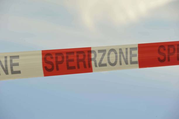 istock closing off a restricted zone with barrier tape 1308810847