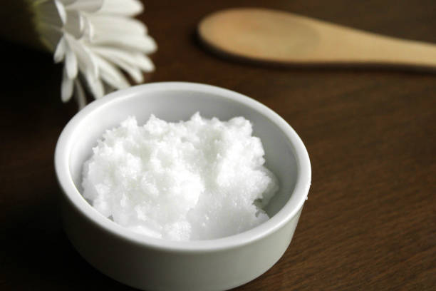 istock Natural coconut oil in a bowl, top view 1308813337