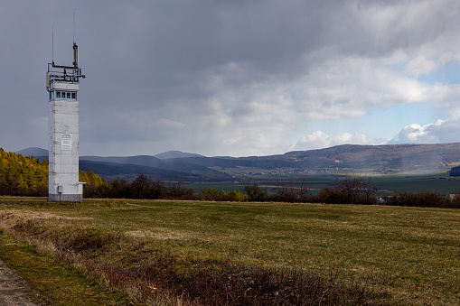 Triangulation station on a hilltop in rural Dumfries and Galloway Scotland on a bright spring morning