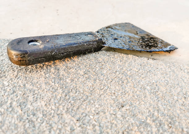 istock brush tool of black coating paint for rooftop ceiling 1308817417