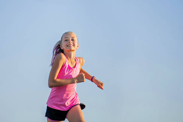istock Girl runs on a sunny summer evening 1308818094
