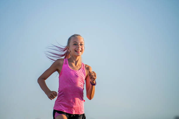 istock Girl runs on a sunny summer evening 1308818136