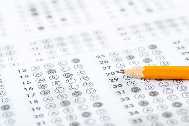 istock testing in exercise and exam paper. computer sheet with pencil in school test room, education concept 1308818640