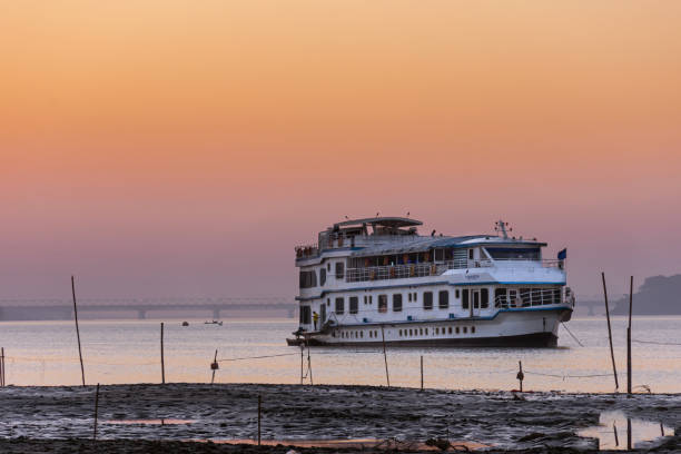 The Brahmaputra River cruise The beautiful golden evening while cruising along the river Brahmaputra, Assam, North east india. brahmaputra river stock pictures, royalty-free photos & images