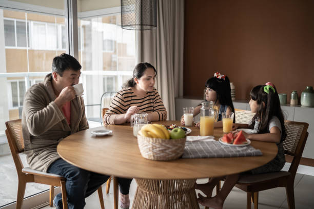 istock Family at home taking breakfast together 1308829597