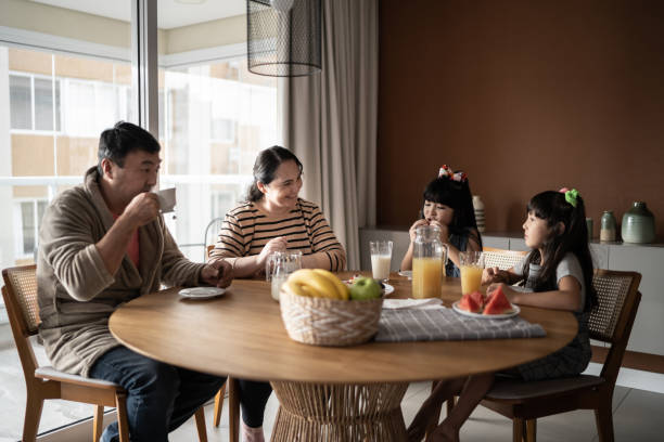 istock Family at home taking breakfast together 1308829610