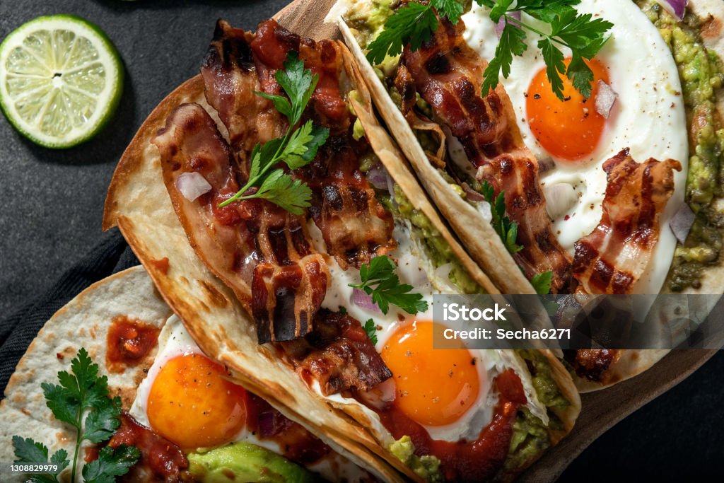 Egg tacos Breakfast tacos with eggs, avocado and bacon Taco Stock Photo