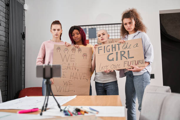 istock Girls holding posters and boycotted while having online rally 1308830551