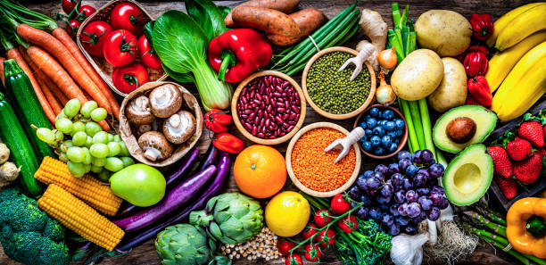 istock Fresh organic vegetables and legumes panoramic background 1308831718