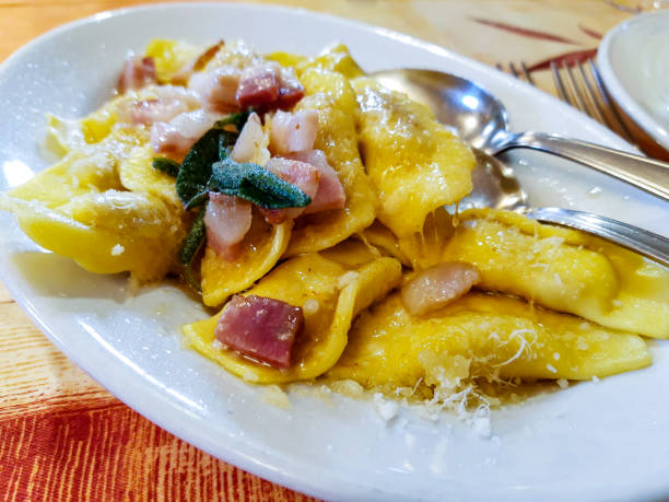 bergamot casoncelli typical dish of Bergamo based on ravioli with butter, sage and bacon italian food photos stock pictures, royalty-free photos & images
