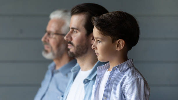 istock Three generations of Caucasian men look in distance 1308834382