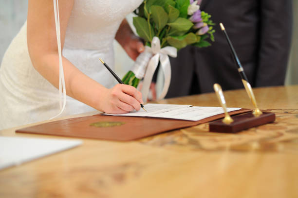 istock Signature of wedding documents. 1308836657