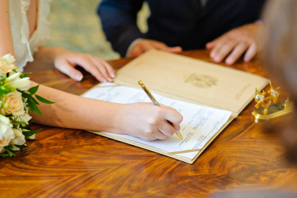 istock Signature of wedding documents. 1308836671