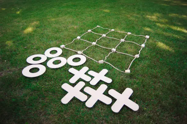 Tic tac toe game on the green grass