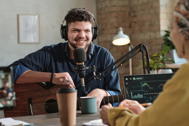 istock Man recording his song in studio 1308838424