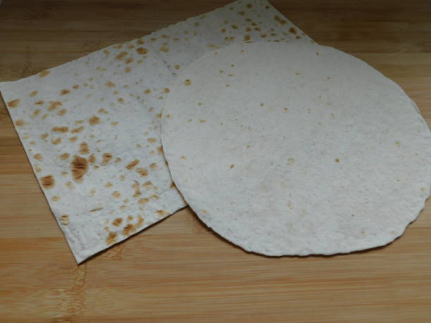 istock Pita, Arabic bread, soft baked flatbreads on wooden background. 1308838472