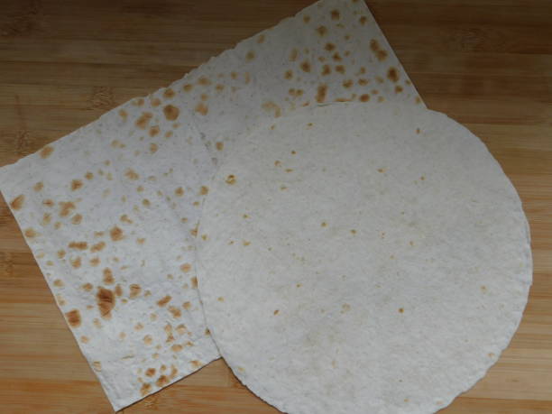 istock Pita, Arabic bread, soft baked flatbreads on wooden background. 1308838501