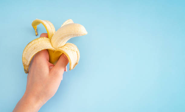istock Yellow bananas on the blue background 1308838635