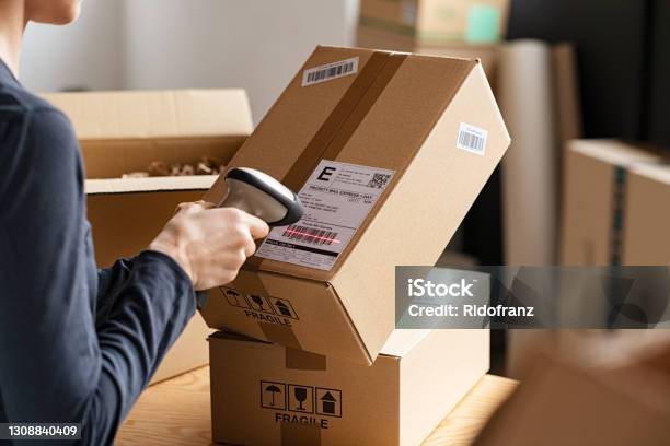 Scanning Parcel Barcode Before Shipment Stock Photo - Download Image Now - Delivering, Box - Container, Package