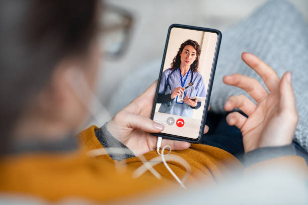 istock Woman doing video call with doctor 1308840659
