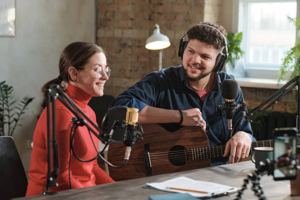 istock Musician with radio dj at office 1308840947
