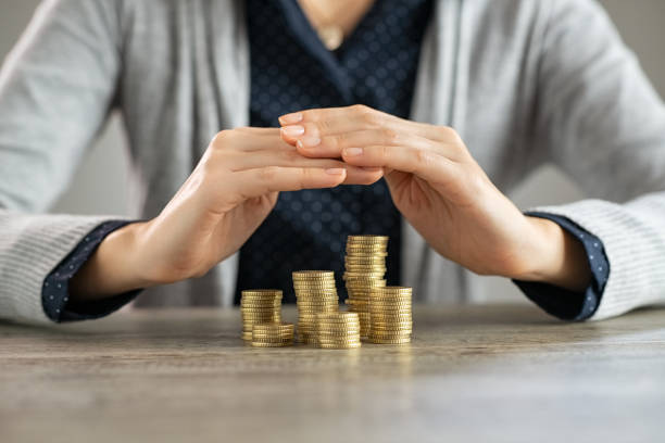 Woman hands protecting savings
