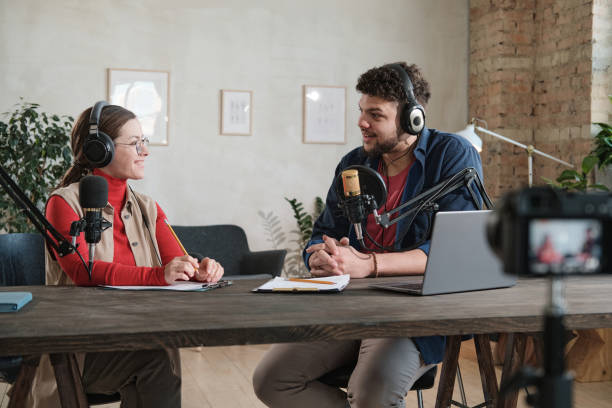 istock Man interviewing a woman at radio 1308842070