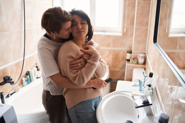 istock Lesbian couple spending time together in the bright bathroom 1308843040
