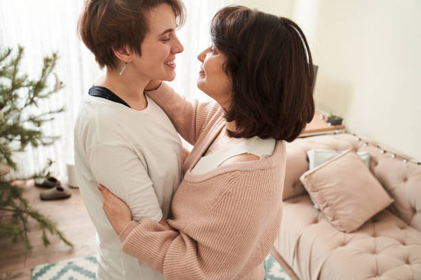 istock Woman expressing positivity while looking at her girlfriend and dancing 1308843050