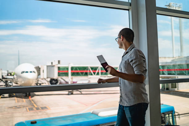 istock Man on airport waiting for a flight 1308843405